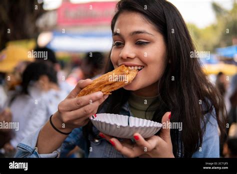 Girl Eating Street Food Potato Puff Pastry Aloo Patties At Outdoor