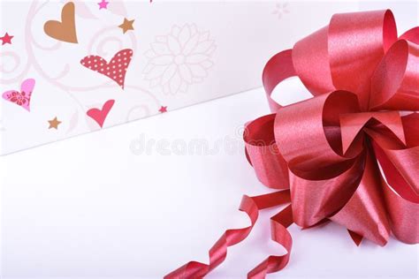 Red Ribbon Bow And Hearts On White Valentines Day Concept Stock Image