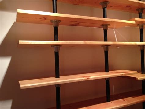 Pipe Shelves Built From Reclaimed Bookshelves