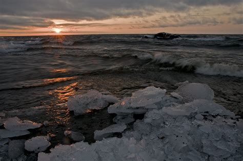 Icy Sunrise On Lake Superior The Sun Peers Through The Clo Flickr