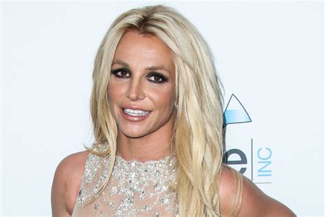 britney spears dances in springy yellow top shorts and platform heels footwear news