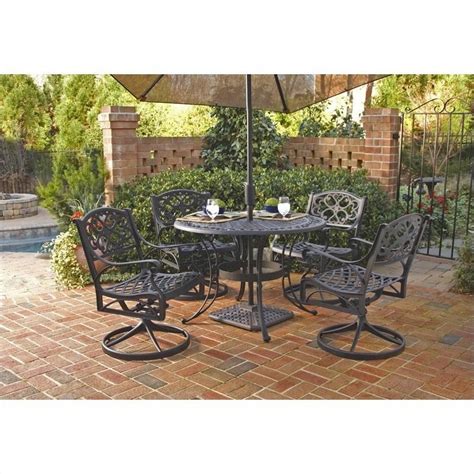 One (1) dining table and six (6) chairs table material: Round Outdoor Dining Table in Black - 5554-3X