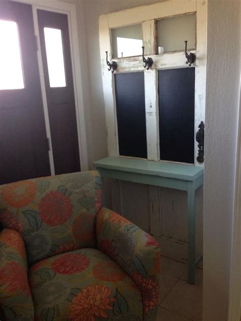 Old Door With Table Built On The Front Chalkboards And Hooks So