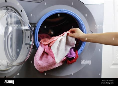 Put Cloth In Washer Stock Photo Alamy