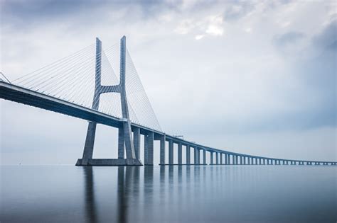 The bridge was designed to withstand an earthquake four times greater than the 1755 earthquake that devastated lisbon. Vasco Da Gama Bridge At Sunrise In Lisbon Portugal He Longest Bridge In Europe Stock Photo ...