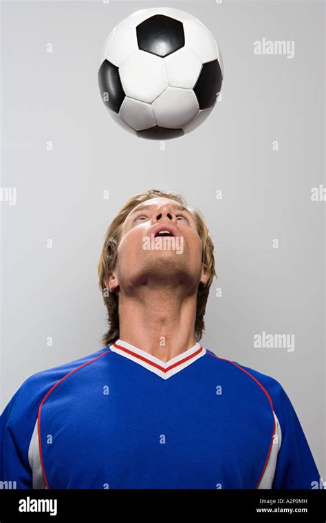 Footballer Heading Football Stock Photo Alamy