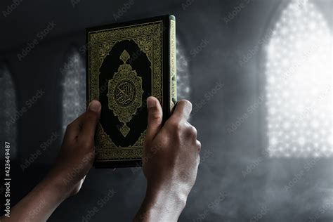 Religious Muslim Man Holding Holy Quran Stock Photo Adobe Stock