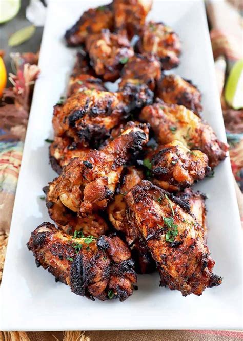 Tuck wings underneath chicken and truss the legs together with twine. Jamaican Jerk Chicken Wings - #MakeitGAP Recipe