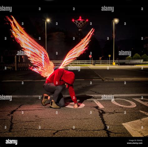Fallen Male Angel With Fire Wings Stock Photo Alamy