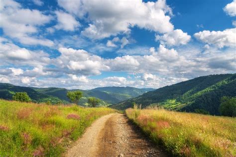 Mountain Dirt Road At Sunny Bright Day In Summer Landscape Stock Image