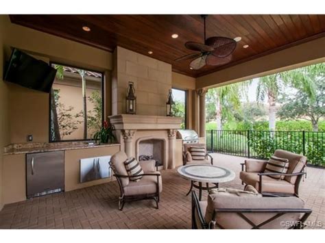 Looking for kitchen ideas for outside? Covered lanai - wood ceiling, fireplace and summer kitchen ...