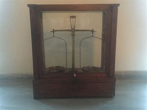 Beautiful Antique Pharmacy Scale Including Weights In A Glass Cabinet