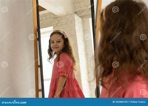 girl looks at herself in the mirror stock image image of fashion happy 252089193