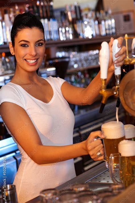 Attractive Bartender Tapping Beer In Bar Stock Foto Adobe Stock