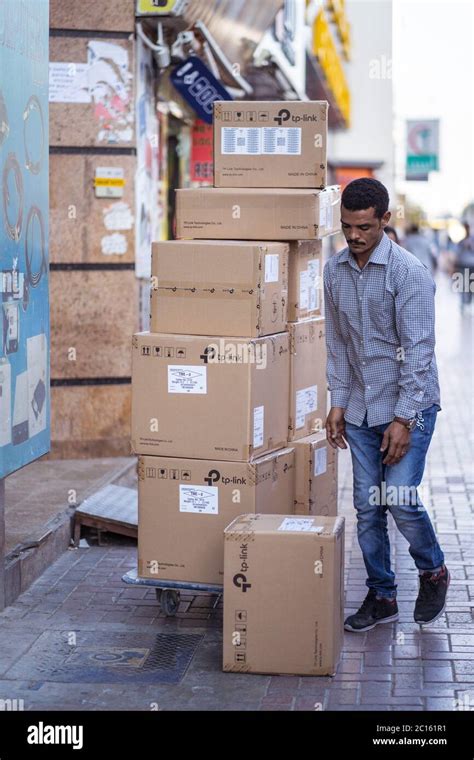 Dubai United Arab Emirates February 1 2020 Worker Man Carrying Cardboard Boxes On The