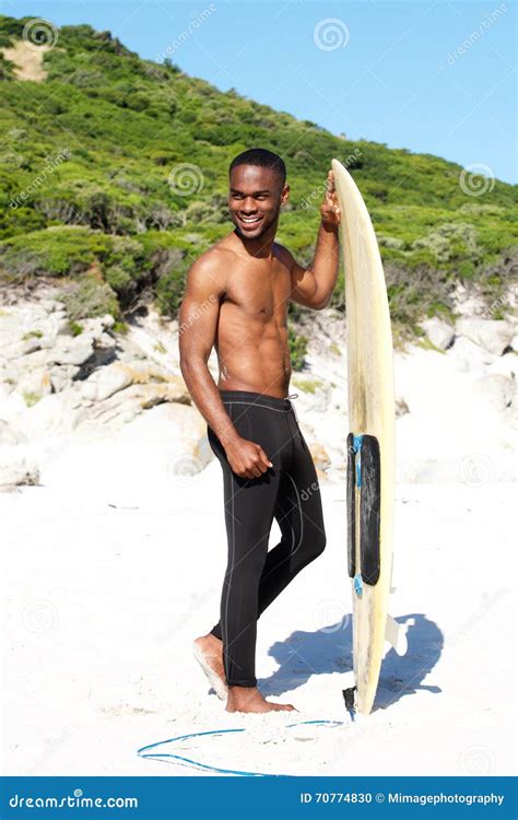 Smiling Young Guy With Surfboard At The Beach Stock Photo Image Of