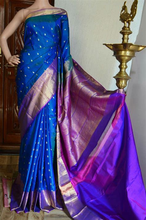 peacock blue pure kanchivaram silk saree with thread woven motif on all over with purple zari