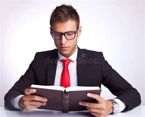 business man wearing glasses reading a book stock image image of cheerful latin 26587281