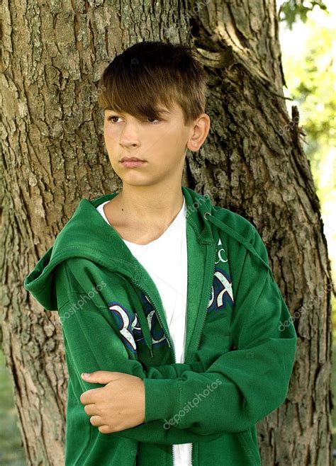 Forget what you thought you knew about boys and sex. Young Teen Boy By Tree — Stock Photo © TrudyWilkerson ...