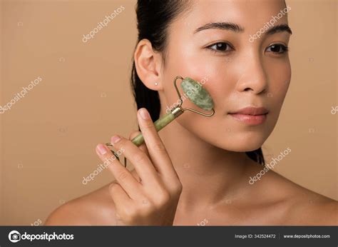 Beautiful Naked Asian Girl Massaging Face Jade Roller Isolated Beige Stock Photo By