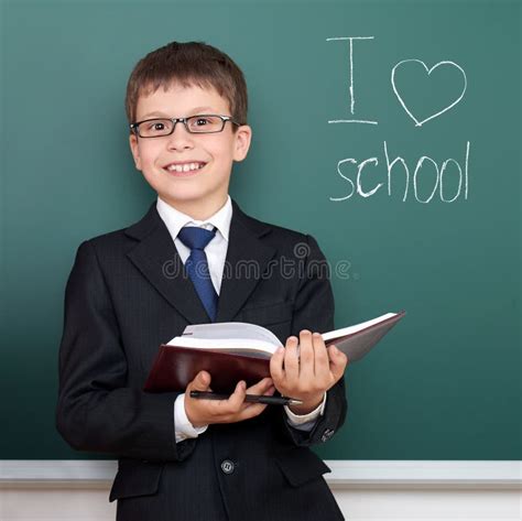 School Boy With Book Portrait On Chalkboard Background I Love School
