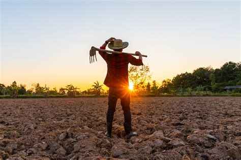 Premium Photo Farmer Working On Field At Sunset Outdoor