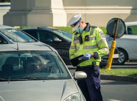 Traffic Police Officer Writing A Ticket To A Female Driver Who Broke The Law Editorial Stock