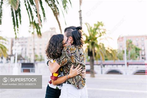 Young Lesbian Couple Embracing Each Other On Street In City Superstock