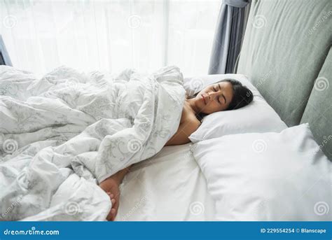 Asian Girl Sleeping Naked With A Slim Body In A White Bed Opposite The