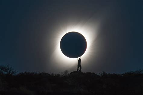 Photographer Captures Perfect Shot Of Person Holding The Total Solar