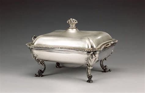A Victorian Silver Two Handled Entrée Dish And Cover On An Old