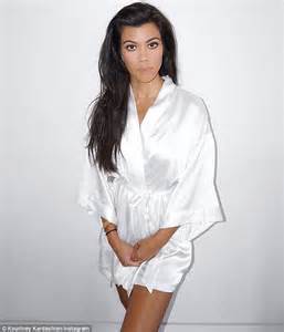 Kourtney Kardashian Shows Off Slender Legs In Slinky White Robe On