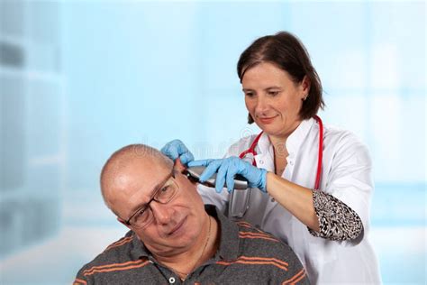 Doctor Examining Ear With Otoscope Stock Image Image Of Patialaquo