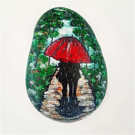 Couple in the rain, hand painted pebble. | Rock painting patterns, Painted rocks, Hand painted rocks
