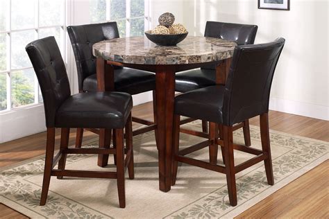 Pub table bistro sets are prefect for a dining nook area or simply the center piece of a small kitchen. Montibello Round Pub Table + 4 Stools at Gardner-White