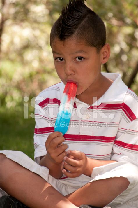 Young Boy Eating Popsicle Stock Photos
