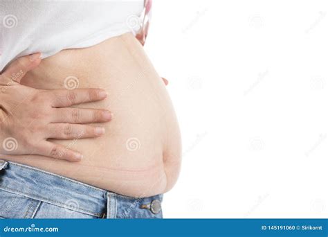 Overweight Woman In Jeans And Fat On Hips And Belly Isolated On White