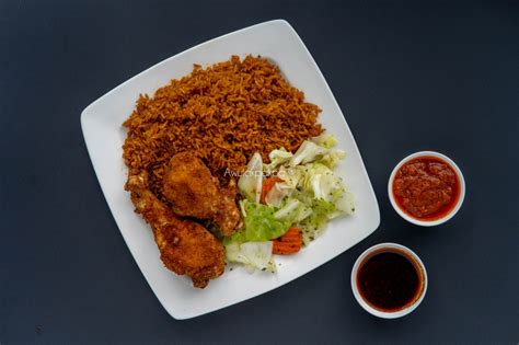Jollof Rice With Fried Chicken And Salad Zippgrocery