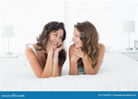 Two Smiling Female Friends Lying In Bed Stock Image Image Of People Female 37200305