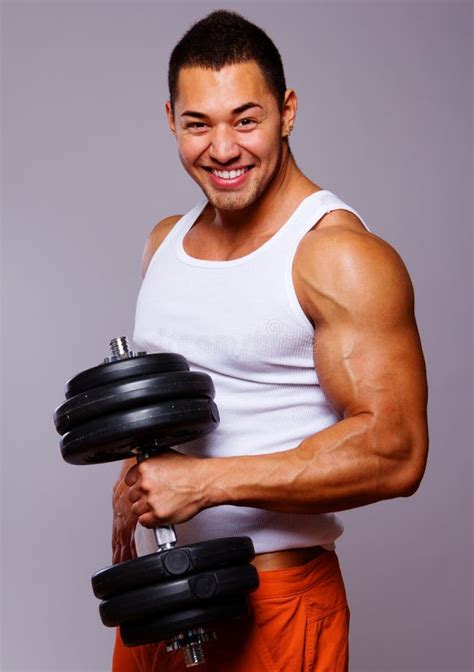 Portrait Of Young Man Lifting Weights Stock Photo Image Of Background