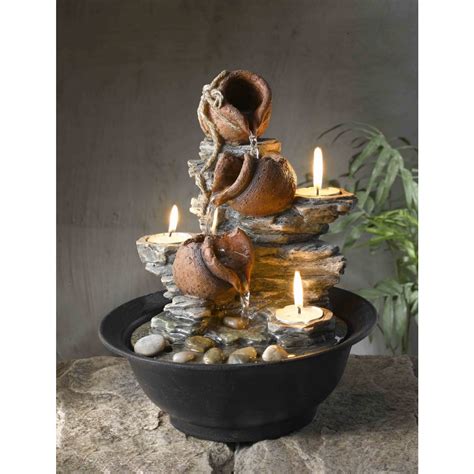 Keep the sound of water within arm's reach with our selection of tabletop fountain designs, ranging from natural slate to sculptural bronze styles. Tavolo Luci Tabletop Mini Pot Fountain with Candles