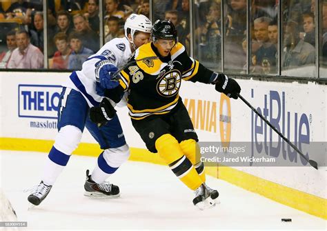 David Krejci Of The Boston Bruins Battles For The Puck Against Andrej