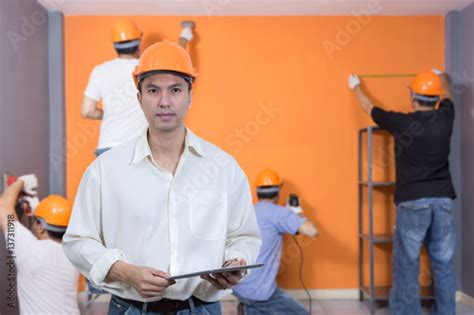 Asian Handsome Architect With Workers Home Improvement Renovation