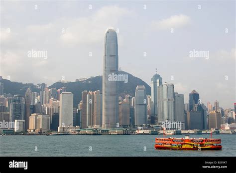 Hong Kong Skyline Ifc Tower And Victoria Harbour Tour Boat Stock Photo