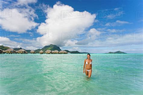 French Polynesia Tahiti Bora Bora Woman In The Ocean With Bungalows