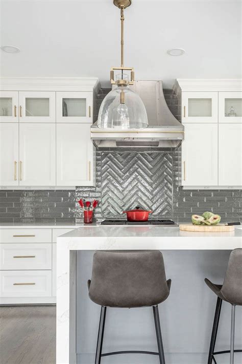 Transitional Kitchen With White Cabinets And Gray Ceramic Herringbone