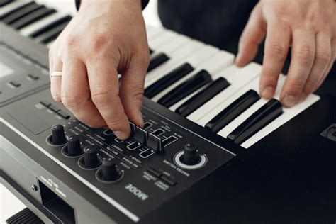 Person Playing Black and White Piano · Free Stock Photo