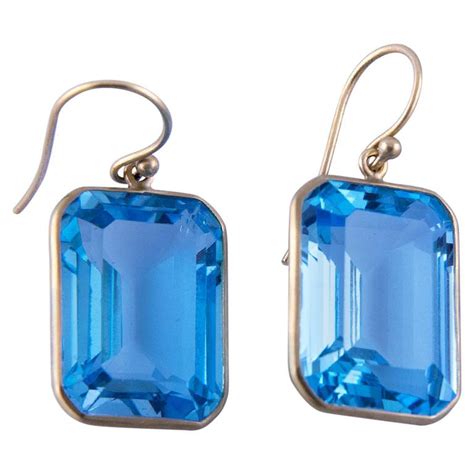 Contemporary Emerald Cut Blue Topaz Gold Drop Earrings For Sale At Stdibs