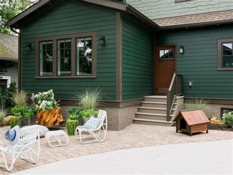 The Garage Is Classic American From The Forest Green Shingled Exterior