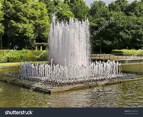 Water Fountain In Japanese Public Park In A Middle Of A Pond Stock